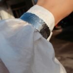 Wholesale statement feather bracelet with thick 3D abstract leaf design, 18K gold and platinum plated brass from JuneJewelry.com.