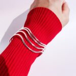 Wholesale silver layered bangle with wavy textured multi-line design in platinum plated brass – minimalist fashion jewelry from JuneJewelry.com.