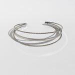 Wholesale geometric cuff bracelet with triple twisted layers, minimalist open bangle in 18K gold or platinum plating from JuneJewelry.com – bulk fashion accessory.