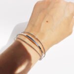 Wholesale geometric cuff bracelet with triple twisted layers, minimalist open bangle in 18K gold or platinum plating from JuneJewelry.com – bulk fashion accessory.