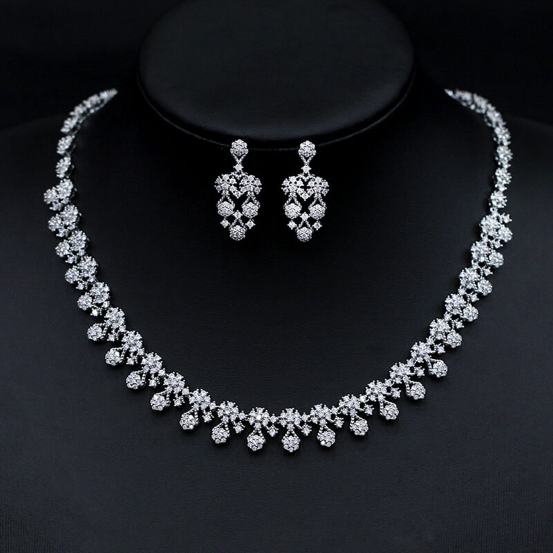 Wholesale floral drop necklace and earring set with platinum plating from JuneJewelry.com – elegant copper fashion jewelry for bulk orders.