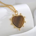 Tiger eye heart pendant necklace in vintage brown tones, 18K gold plated, wholesale fashion jewelry from JuneJewelry.com