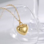 Wholesale 3D heart pendant necklace in 18K gold plated brass – minimalist love charm jewelry from JuneJewelry.com.