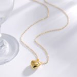 Wholesale 3D heart pendant necklace in 18K gold plated brass – minimalist love charm jewelry from JuneJewelry.com.