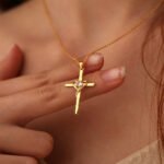 Wholesale cross heart pendant necklace with cubic zirconia in 18K gold plated brass – street style jewelry from JuneJewelry.com.