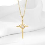 Wholesale cross heart pendant necklace with cubic zirconia in 18K gold plated brass – street style jewelry from JuneJewelry.com.