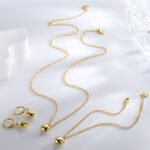 Wholesale heart-shaped jewelry set with necklace, bracelet, and earrings in 18K gold plated brass – romantic trio from JuneJewelry.com.