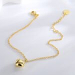 Wholesale heart-shaped jewelry set with necklace, bracelet, and earrings in 18K gold plated brass – romantic trio from JuneJewelry.com.