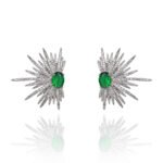 Wholesale starburst stud earrings with a central oval cubic zirconia and micro-pavé stones, platinum-plated brass and 925 silver needle from JuneJewelry.com.