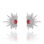 Wholesale starburst stud earrings with a central oval cubic zirconia and micro-pavé stones, platinum-plated brass and 925 silver needle from JuneJewelry.com.