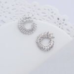 Wholesale marquise zircon earrings with a swirling leaf design on rhodium plated copper and 925 sterling silver pins from JuneJewelry.com – elegant fashion jewelry for bulk orders.