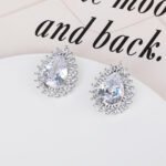 Wholesale Pave Cubic Zirconia Earrings with a silver plated finish and clear cubic zirconia stones from JuneJewelry.com – unique fashion jewelry for bulk orders.