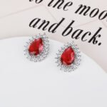 Wholesale Pave Cubic Zirconia Earrings with a silver plated finish and clear cubic zirconia stones from JuneJewelry.com – unique fashion jewelry for bulk orders.