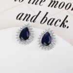 Wholesale Pave Cubic Zirconia Earrings with a silver plated finish and clear cubic zirconia stones from JuneJewelry.com – unique fashion jewelry for bulk orders.