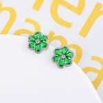 Wholesale Colorful Flower Stud Earrings with a gold plated finish and emerald-colored and clear cubic zirconia stones from JuneJewelry.com – unique fashion jewelry for bulk orders.