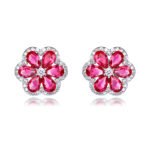 Wholesale Colorful Flower Stud Earrings with a gold plated finish and emerald-colored and clear cubic zirconia stones from JuneJewelry.com – unique fashion jewelry for bulk orders.