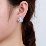 Wholesale Colorful Flower Stud Earrings with a gold plated finish and emerald-colored and clear cubic zirconia stones from JuneJewelry.com – unique fashion jewelry for bulk orders.