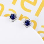 Wholesale Round Stud Earrings with a gold plated finish and clear cubic zirconia stones from JuneJewelry.com – unique fashion jewelry for bulk orders.