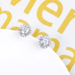 Wholesale Round Stud Earrings with a gold plated finish and clear cubic zirconia stones from JuneJewelry.com – unique fashion jewelry for bulk orders.