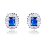 Wholesale emerald cut stud earrings with a starburst halo of CZ stones, a platinum-plated brass base, and 925 silver needle from junejewelry.com.