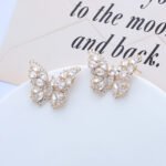 Wholesale Butterfly Stud Earrings with gold plating and cubic zirconia stones from JuneJewelry.com – unique fashion jewelry for bulk orders.