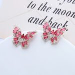 Wholesale Butterfly Stud Earrings with gold plating and cubic zirconia stones from JuneJewelry.com – unique fashion jewelry for bulk orders.