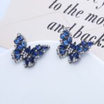 Wholesale Butterfly Stud Earrings with gold plating and cubic zirconia stones from JuneJewelry.com – unique fashion jewelry for bulk orders.
