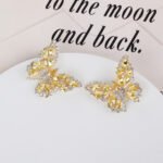 Wholesale Butterfly Stud Earrings with gold plating and cubic zirconia stones from JuneJewelry.com – unique fashion jewelry for bulk orders.