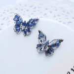 Wholesale Butterfly Stud Earrings with gold plating and cubic zirconia stones from JuneJewelry.com – unique fashion jewelry for bulk orders.