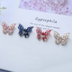 Wholesale Butterfly Stud Earrings with gold plating and cubic zirconia stones from JuneJewelry.com – unique fashion jewelry for bulk orders.