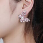 Wholesale Butterfly Stud Earrings with gold plating and cubic zirconia stones from JuneJewelry.com – unique fashion jewelry for bulk orders.