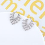 Wholesale CZ drop earrings with fan-shaped crystal and zircon stones, featuring a 925 silver needle and gold plating from JuneJewelry.com, ideal for bridal and fashion jewelry wholesale.