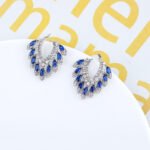 Wholesale CZ drop earrings with fan-shaped crystal and zircon stones, featuring a 925 silver needle and gold plating from JuneJewelry.com, ideal for bridal and fashion jewelry wholesale.