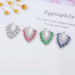 Wholesale CZ drop earrings with fan-shaped crystal and zircon stones, featuring a 925 silver needle and gold plating from JuneJewelry.com, ideal for bridal and fashion jewelry wholesale.