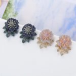 Wholesale gold flower stud earrings with pink and white CZ pavé stones and a 925 silver needle from junejewelry.com – unique fashion jewelry for bulk orders.