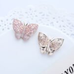 Wholesale butterfly stud earrings with baguette and pavé CZ stones on a platinum-plated brass base and 925 silver needle from junejewelry.com – unique fashion jewelry for bulk orders.