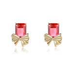 Wholesale starburst stud earrings with a central oval CZ and pavé stones on a platinum-plated brass base from junejewelry.com – unique fashion jewelry for bulk orders.