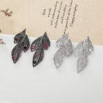 Wholesale Butterfly Stud Earrings with a silver plated finish and clear cubic zirconia stones from JuneJewelry.com – unique fashion jewelry for bulk orders.
