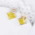 Wholesale geometric drop earrings with a square-cut CZ stone and baguette circle top from junejewelry.com – modern fashion jewelry for bulk orders.