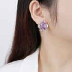 Wholesale zircon stud earrings with a clear rectangular stone and cluster on rhodium plated copper and 925 sterling silver pins from JuneJewelry.com – elegant fashion jewelry for bulk orders.