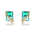 Wholesale gold leaf earrings with two-toned yellow rectangular CZ stones from junejewelry.com – unique fashion jewelry for bulk orders.