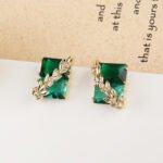 Wholesale gold leaf earrings with two-toned yellow rectangular CZ stones from junejewelry.com – unique fashion jewelry for bulk orders.