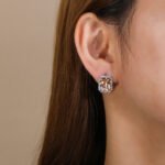 Wholesale square halo stud earrings with a double halo of CZ stones, a platinum-plated brass base, and 925 silver needle from junejewelry.com.