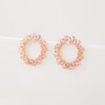 Wholesale pink zircon earrings with a circular design, platinum-plated copper, and 925 silver needles from JuneJewelry.com.