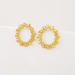 Wholesale pink zircon earrings with a circular design, platinum-plated copper, and 925 silver needles from JuneJewelry.com.