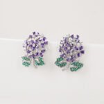 Wholesale Enamel Flower Stud Earrings with a gold plated finish and cubic zirconia stones from JuneJewelry.com – unique fashion jewelry for bulk orders.