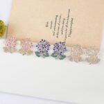 Wholesale Enamel Flower Stud Earrings with a gold plated finish and cubic zirconia stones from JuneJewelry.com – unique fashion jewelry for bulk orders.