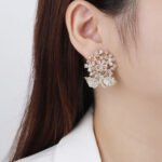 Wholesale Enamel Flower Stud Earrings with a gold plated finish and cubic zirconia stones from JuneJewelry.com – unique fashion jewelry for bulk orders.