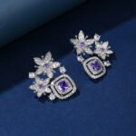 Wholesale pink flower earrings with a zircon flower cluster on rhodium plated copper and 925 sterling silver pins from JuneJewelry.com – elegant floral jewelry for bulk orders.