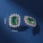 Wholesale blue gemstone earrings with a zircon sunburst on rhodium plated copper and 925 sterling silver pins from JuneJewelry.com – elegant fashion jewelry for bulk orders.